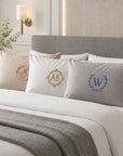Custom embroidered cotton pillowcase with monogram on bed