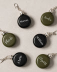 Custom engraved round hip flask keyring in black and army green wedding favour