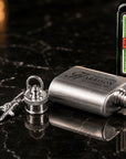 Close-up of laser engraved name on personalised 1oz mini hip flask keyring