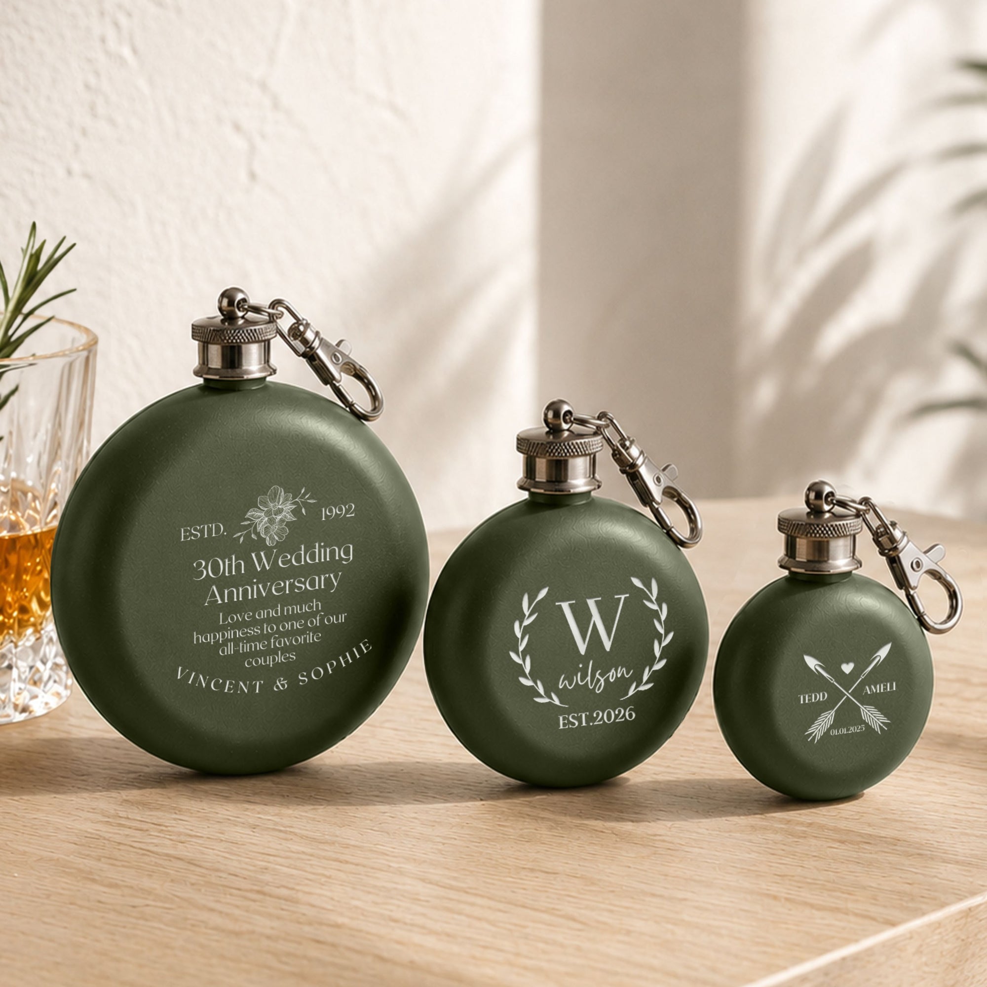 Close-up of laser engraved name on personalised round hip flask keyring