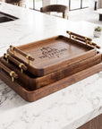 Personalised black walnut serving tray set with brass and wood handles, engraved with a family name