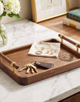 Personalised black walnut valet tray holding keys and jewellery on a vanity