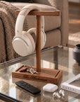 Personalised walnut headphone stand with headphones and keys in the storage tray